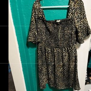 Black dress with greenish/brown and white pattern all over